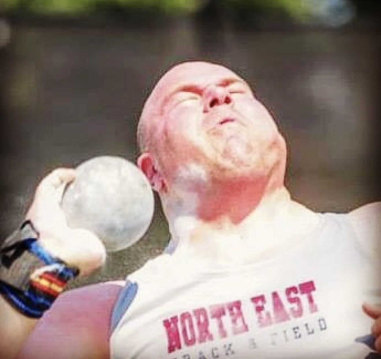 Mike Pellet competing in the shot put
